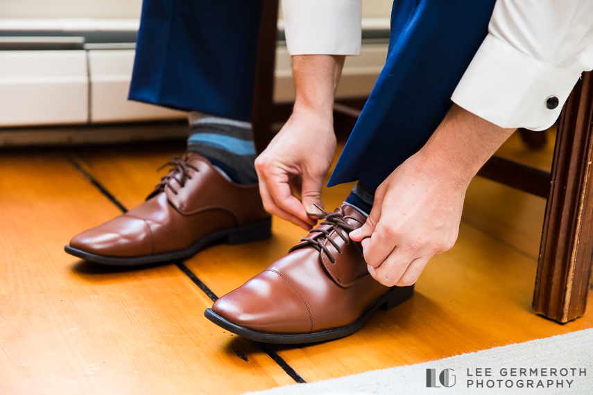 Groom tying shoes - The Barn at the Bellows Walpole Inn Wedding Photography by Lee Germeroth Photography
