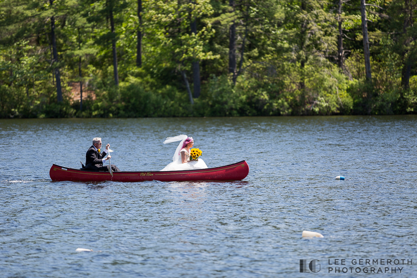 Bride in canoe -- Camp Takodah Wedding in Richmond NH by Lee Germeroth Photography