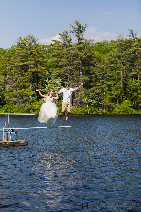 Bride and groom jumping into lake -- Camp Takodah Wedding in Richmond NH by Lee Germeroth Photography