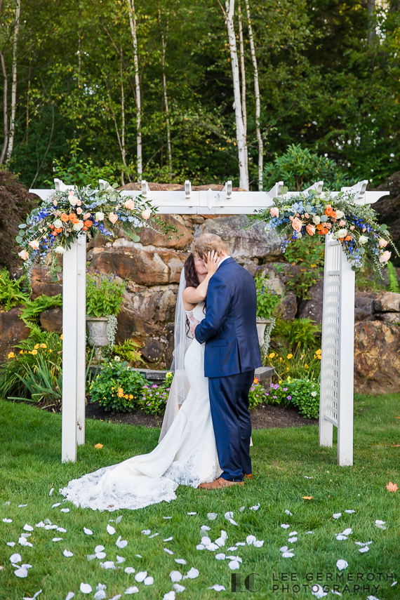Bride and groom's first kiss | Hidden Hills Estate Rindge NH Wedding Photography by Lee Germeroth Photography