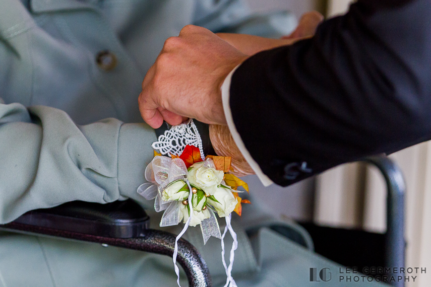 Pinning boutonniere on Grandmother - New Hampshire Country Club Wedding by Lee Germeroth Photography