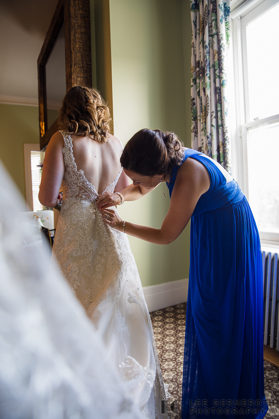 Bride getting into her dress -- Omni Mount Washington Resort Wedding Photography by Lee Germeroth Photography