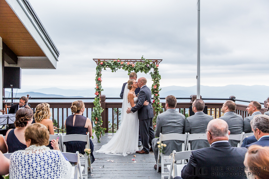Bride and Grooms first kiss - Stowe Mountain Resort Wedding by Lee Germeroth Photography