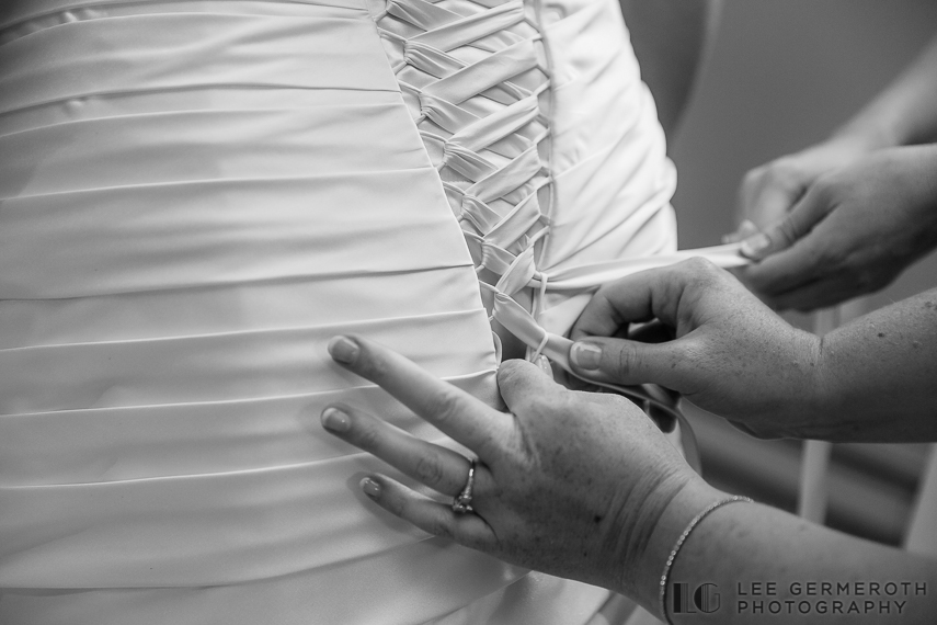 Bride putting on dress - Walpole New Hampshire Wedding by Lee Germeroth Photography